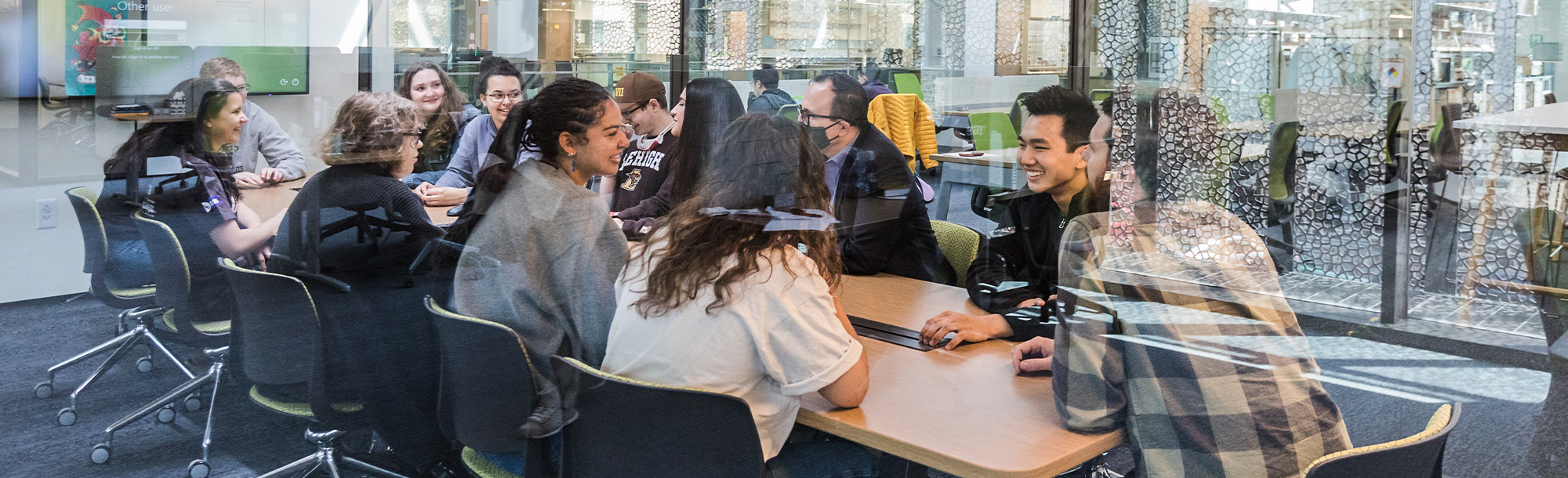 Students sitting and talking at a table