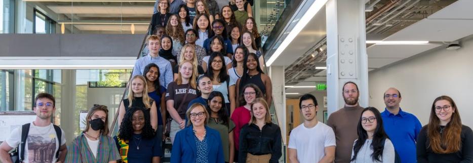 Image of the College of Health, students, faculty, staff on a staircase in the Health, Science & Technology building on Lehigh's campus