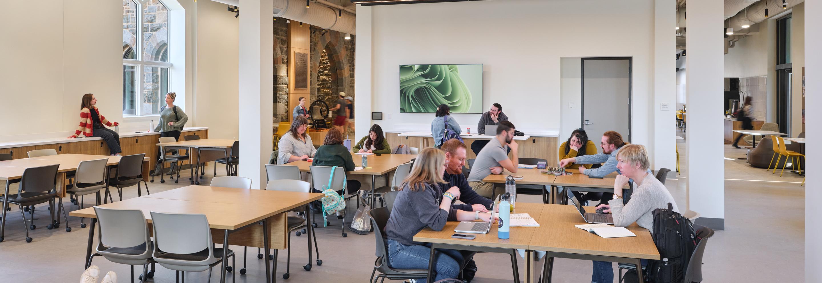 Students working together in Clayton UC building